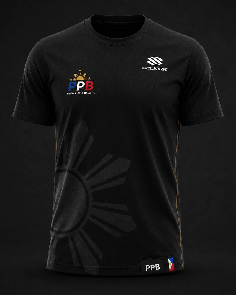 Front of the black PPB Official Shirt: small PPB logo with the Philippine sun on the left chest, Selkirk logo on the right chest, and a large tonal black-on-black Philippine sunburst across the lower front.